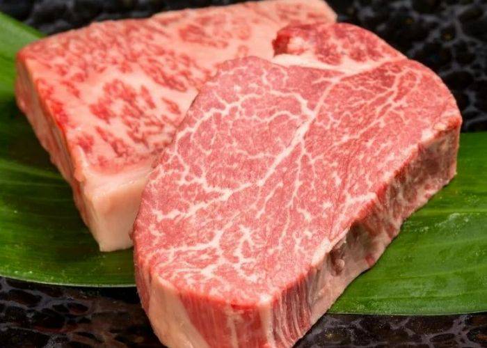 Two thick cuts of premium beef at Teppanryori Mimitei with delicate marbling.